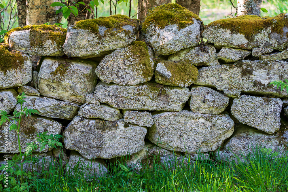 Dry Stone Wall with moss in the nature.