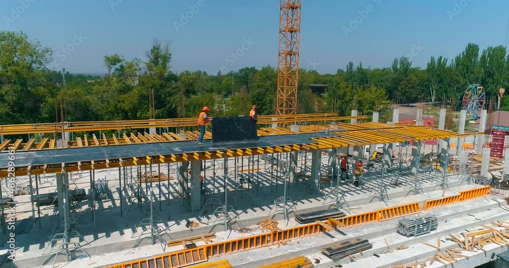 Construction process of a modern football stadium. Builders make