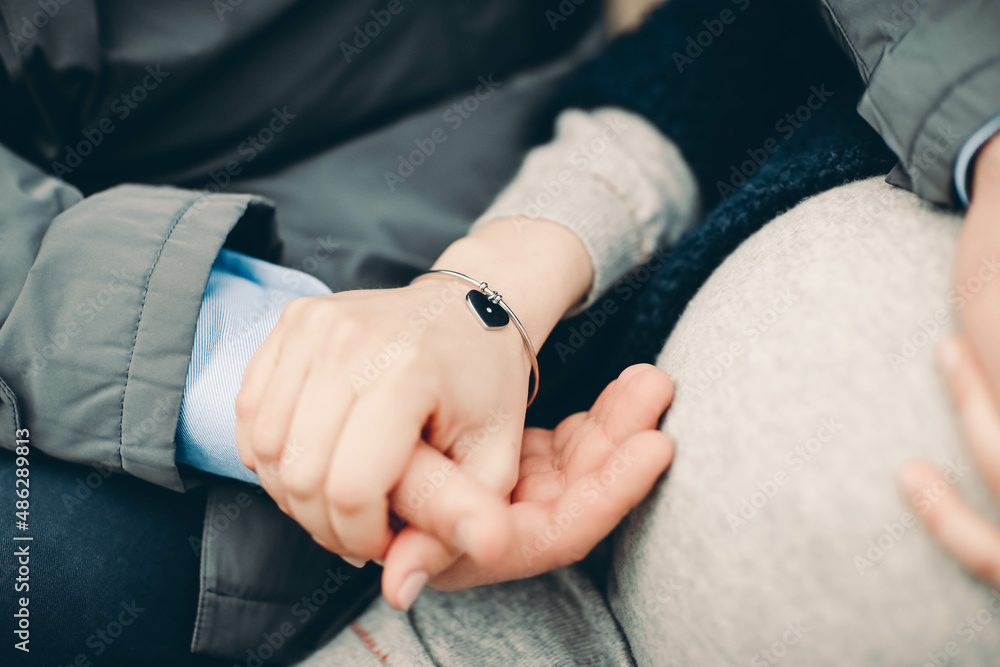 close up of a person holding hands