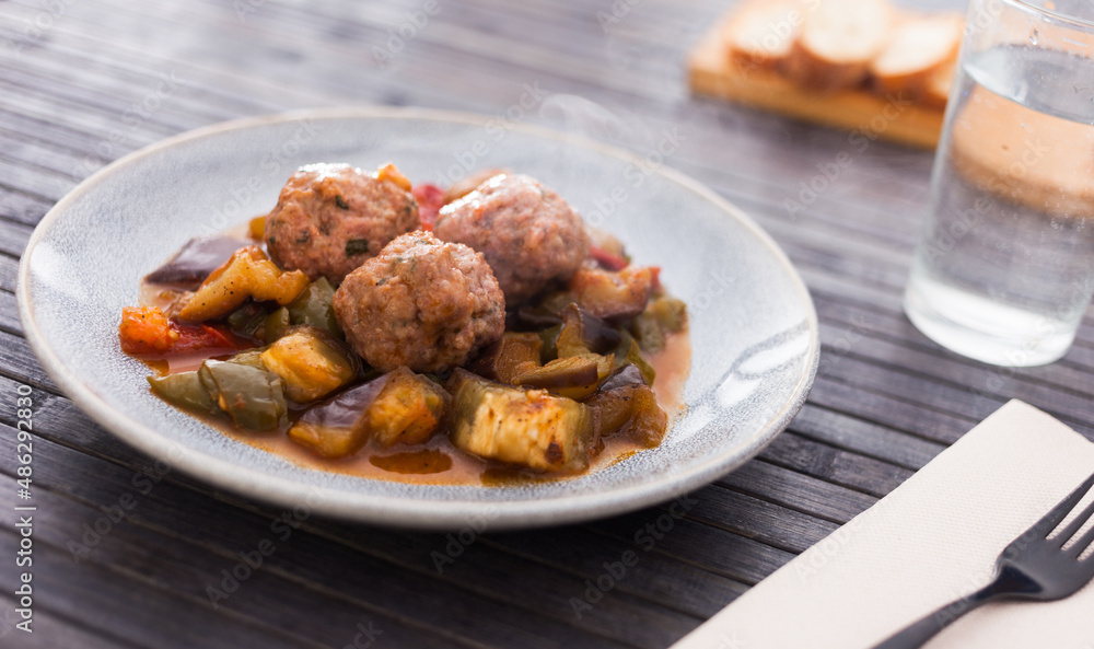 steamed meatballs with stewed vegetables with haze on plate steamed meatballs with stewed vegetables with haze on plate