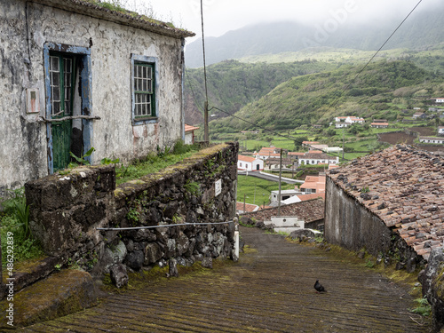 Road that descends towards Fajãzinha, flanked by an abandoned house with traditional architecture. In the background the incredible open valley of Fajãzinha.
Lajes das Flores, Flores Island. photo