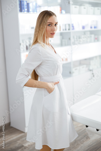 Young woman cosmologist standing in beauty salon