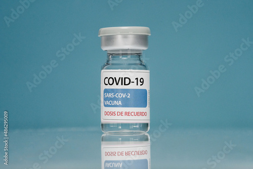 Coronavirus booster vaccine on blue background