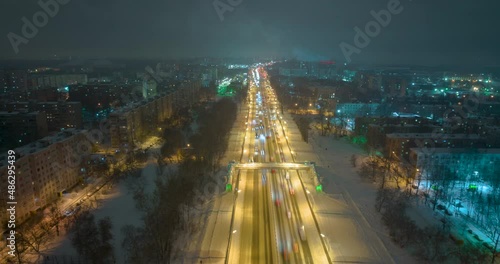 Pedestrian bridge over the highway Enthusiasts, night traffic in the city