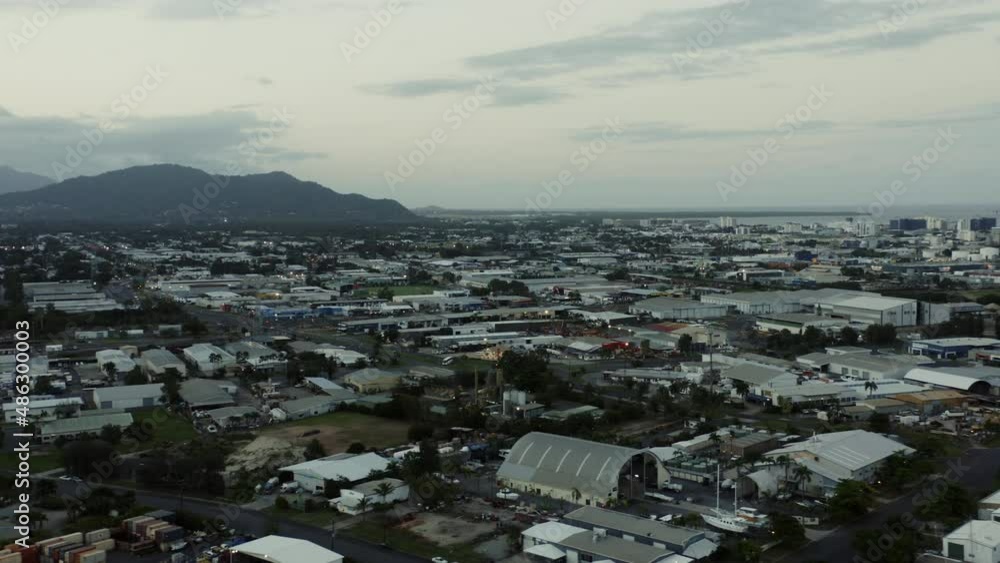 Aerial drone view over Australian City of Cairns with giant mountain and ocean in background after sunset - Aerial drone view over Australian City of Cairns with giant mountain and ocean in background after sunset -