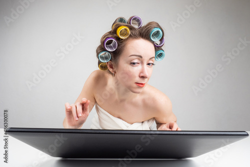 Housewife in front of lapto...
