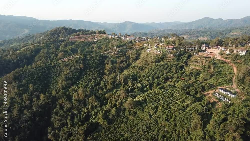 Group of buildings (such as house, resort etc) on the mountains in Pong District of Phayao province, Thailand view from drone. Group of buildings (such as house, resort etc) on the mountains in Pong District of Phayao province, Thailand view from drone.