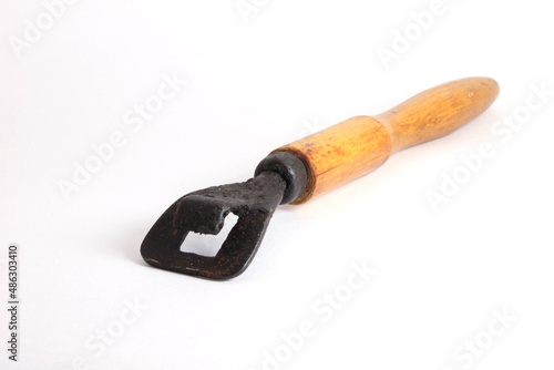 Chapelnik - national Slavic kitchen utensils, a removable handle for a frying pan on a white background. 