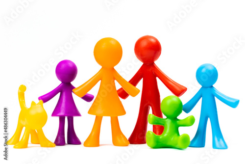 Figurines of the family stand on white isolated background. Concept of classic traditional family  values  unity and loyalty  strong and healthy. Society  procreation photo