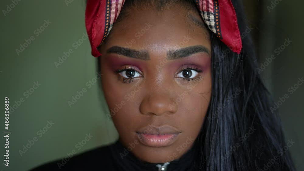 A young black woman portrait looking at camera a teen Brazilian girl A young black woman portrait looking at camera a teen Brazilian girl
