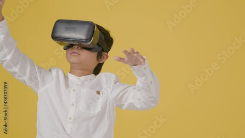 Mid Shot of Little Boy Playing Virtual Reality photo
