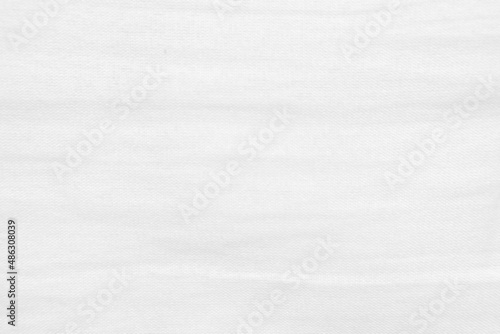 Old white cotton has creases fabric texture used as background. Empty white fabric background of soft and smooth textile material. There is space for text..