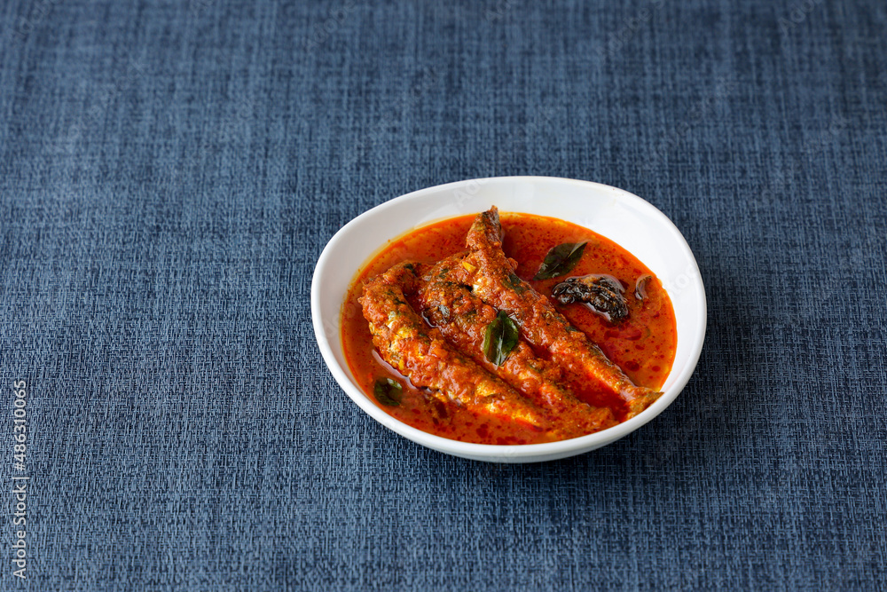 Top view of Sardine fish curry hot spicy Kerala masala fish curry for