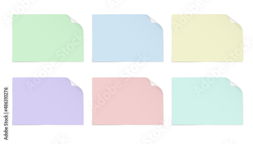 Sheets of paper of different colors with a bent upper right corner with a shadow under it, isolated on a white background.