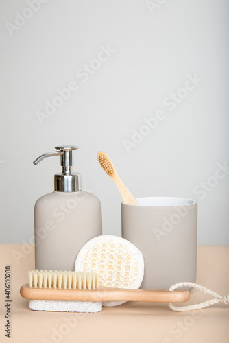 wooden eco-friendly toothbrush with cup, bathroom soap dispenser, washcloth and shower brush