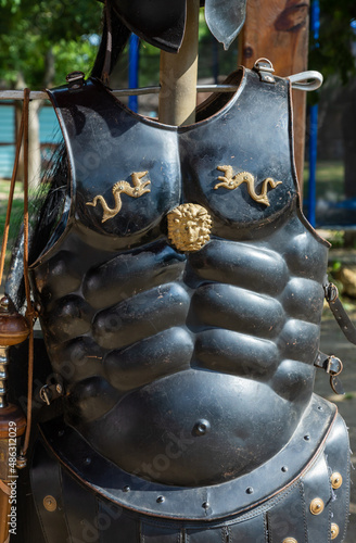Ancient metal armor is an iron detail. outdoors