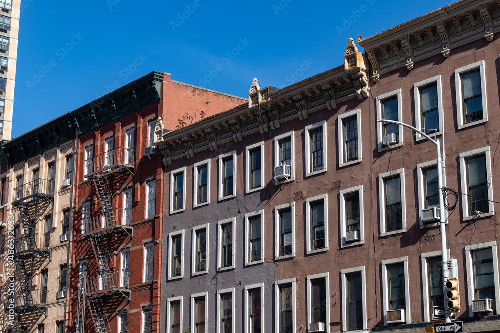 Row of Colorful Old Buildings with Fire Escapes on the Upper East Side of New York City