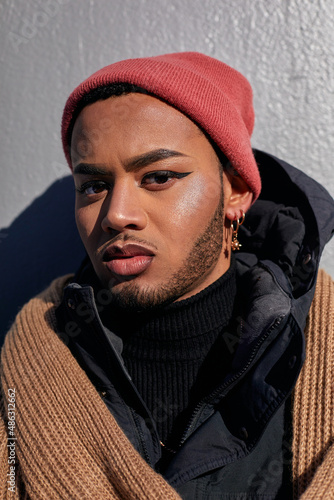 USA, New York City, Portrait of queer man in warm clothing photo