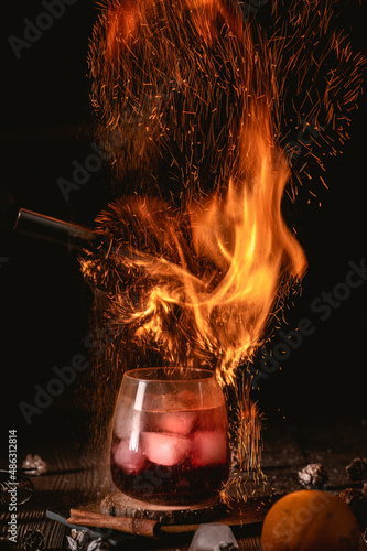 Hot cocktail with cranberry and ice
