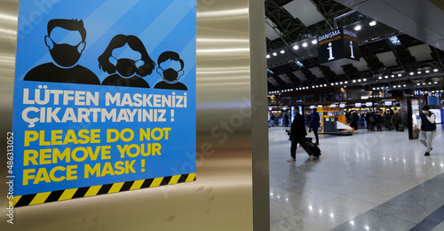 Sign warning for a mandatory face mask use due to COVID-19 pandemic is seen in the departures terminal of Istanbul Sabiha Gokcen international airport, Turkey. photo