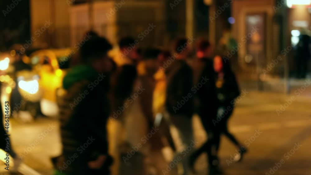 Defocused people are crossing the street at night time in Istanbul, Kadikoy District. Cars are waiting to move in the background.
Defocused people are crossing the street at night time in Istanbul, Kadikoy District. Cars are waiting to move in the background.