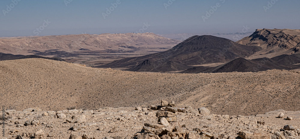 View of Ramon Crater from West to East as seen from Mount Ramon, a 500 m deep, the world's largest erosion cirque, located in the Negev Desert, south of Beer Sheba, Israel. - obrazy, fototapety, plakaty 