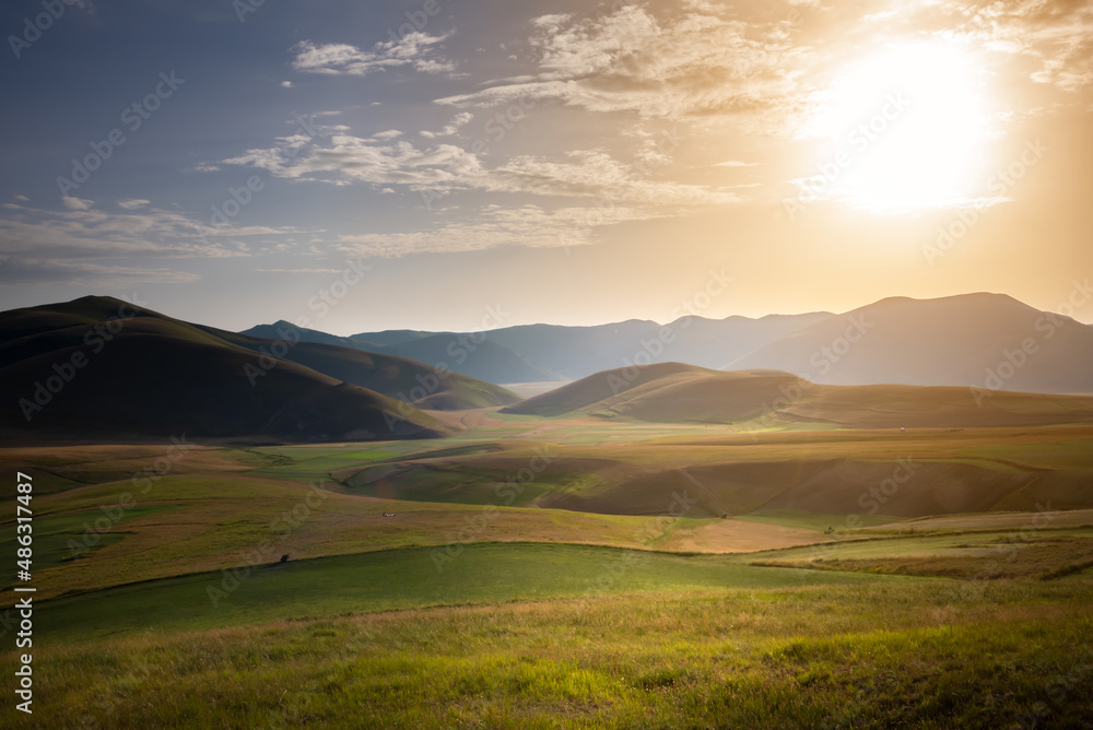 Valley with green agricultural fields in summer Valley with green agricultural fields in summer