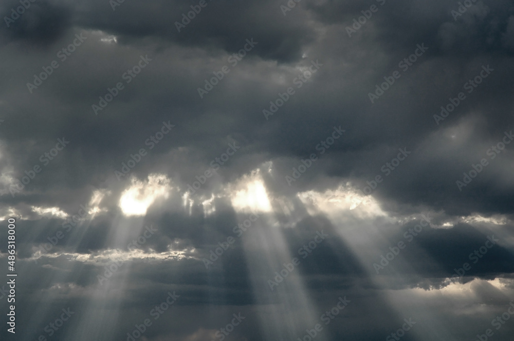 Rays of Sunlight in Storm Clouds for Hope and Faith