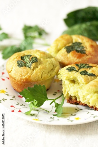 Patrick's Day Buns or muffins of green color with spinach juice of a trefoil of parsley leaves. photo