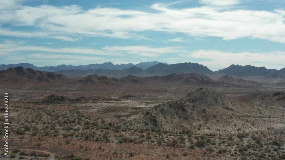 An aerial shot of the Kofa Mountain range south of Quartzite, Arizona on a winter day. The camera makes a pedestal up motion. An aerial shot of the Kofa Mountain range south of Quartzite, Arizona on a winter day. The camera makes a pedestal up motion.