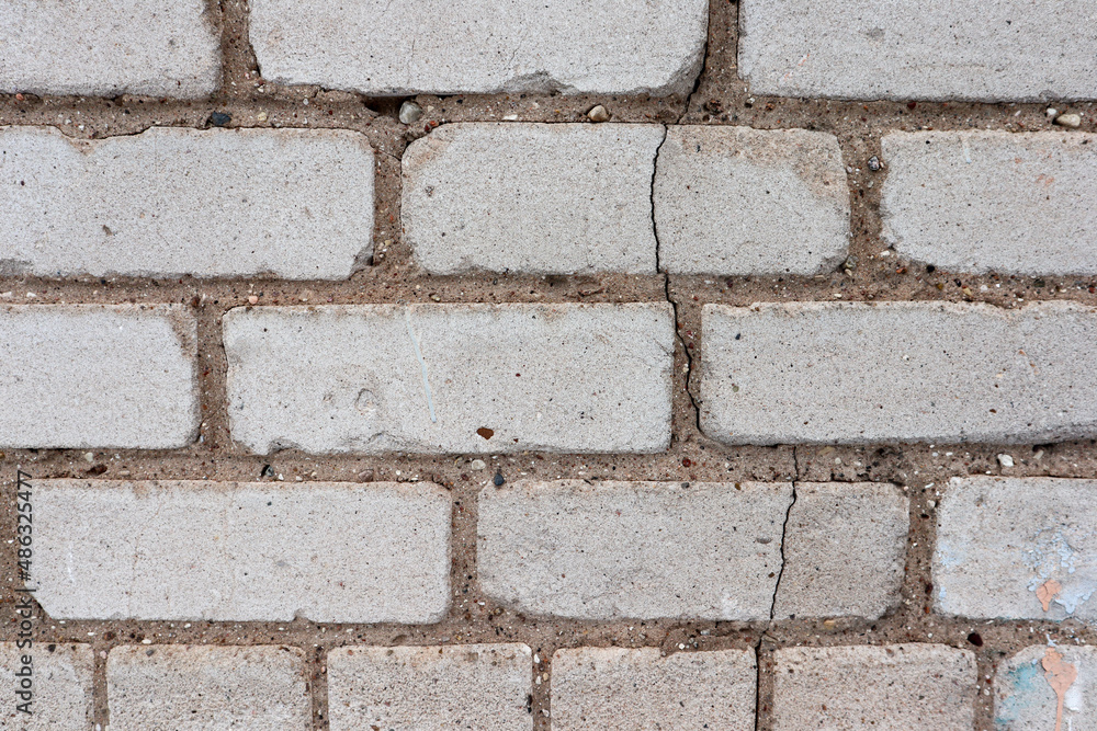 cracked white brick wall close up cracked white brick wall close up