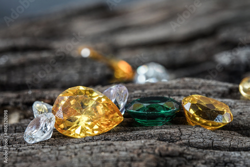 Natural Sapphire gemstone, Jewel or gems on black shine color, natural yellow gemstones on stone