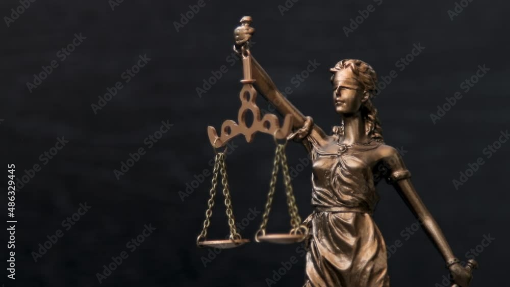 Themis Statue Of The Lady Justice On Black Background. Legal law concept. Themis Statue Of The Lady Justice On Black Background. Legal law concept.