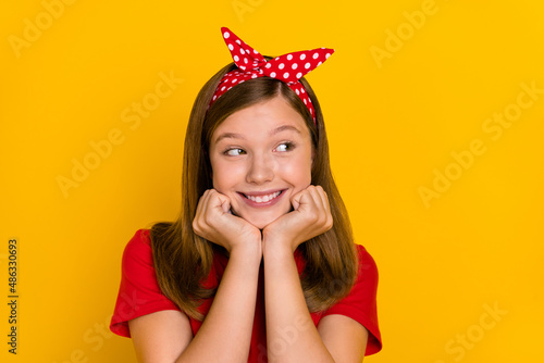 Photo of young pretty good-looking teen female look empty space imagine inspired isolated on yellow color background