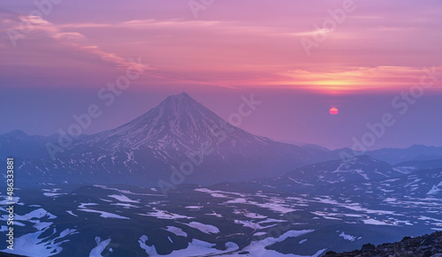 Sunrise from the top of the Gorely volcano and view to the Vilyuchinsky volcano in the Kamchatka Peninsula,Russia. photo
