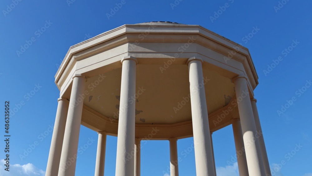 The Gazebo, a round temple with a dome supported by circular columns. The temple is located in the center of the beautiful Mascagni terrace on the seafront of Livorno, Tuscany, Italy. The Gazebo, a round temple with a dome supported by circular columns. The temple is located in the center of the beautiful Mascagni terrace on the seafront of Livorno, Tuscany, Italy.