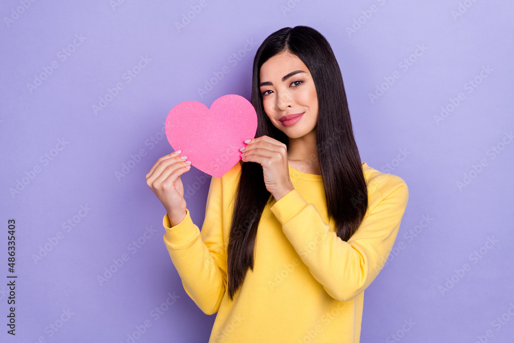 Portrait of good mood adorable female present boyfriend valentine day gift isolated on purple color background Portrait of good mood adorable female present boyfriend valentine day gift isolated on purple color background