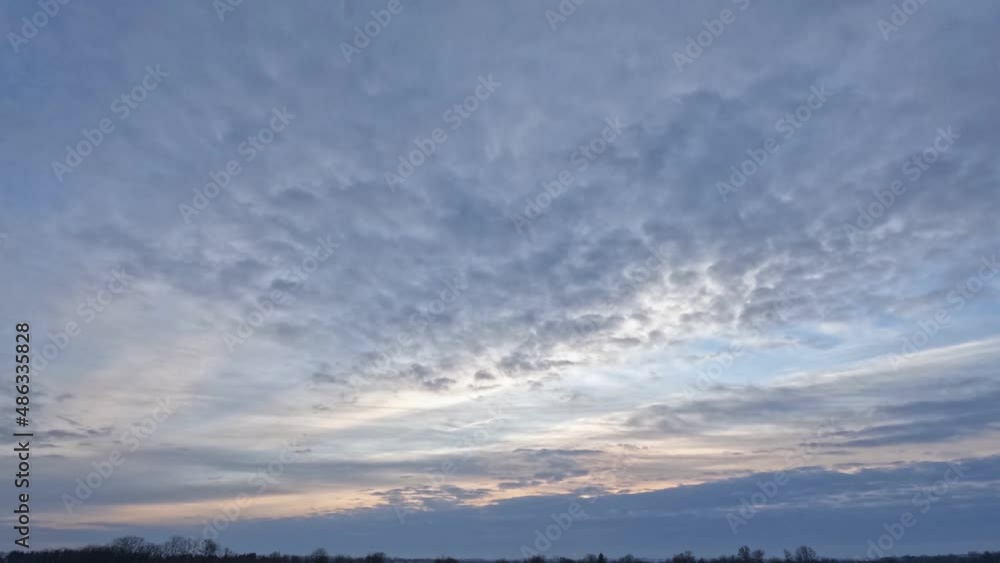 Time lapse of sunrise with thick clouds that from time to time open the view of the sun. Time lapse of sunrise with thick clouds that from time to time open the view of the sun.