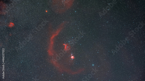 The Orion constellation, the star of Betelgeuse and the nebulas in the night sky full of stars photo