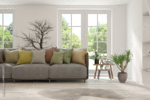 Wallpaper Mural White living room with sofa and summer landscape in window. Scandinavian interior design. 3D illustration Torontodigital.ca