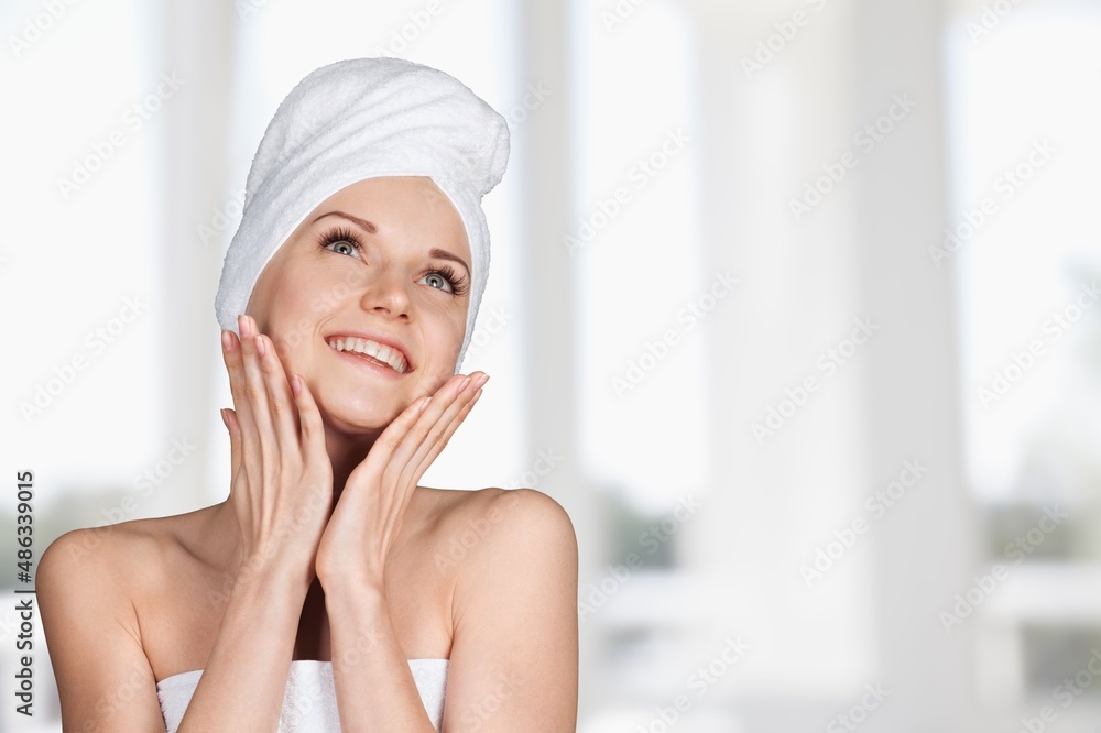 Calm young woman relaxing after taking a shower bath. Body skin and hair care Calm young woman relaxing after taking a shower bath. Body skin and hair care
