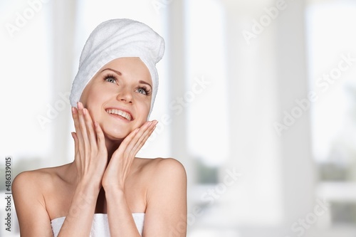 Calm young woman relaxing after taking a shower bath. Body skin and hair care