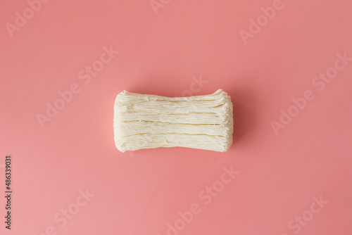 Dried cracked soap on a pink background. Empty space for the text.