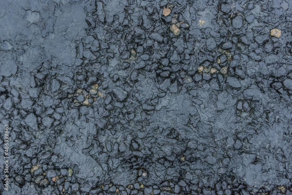 Fuel pollution soil dirt oil blue rough stone surface of the earth toxic industry dark rock background Fuel pollution soil dirt oil blue rough stone surface of the earth toxic industry dark rock background