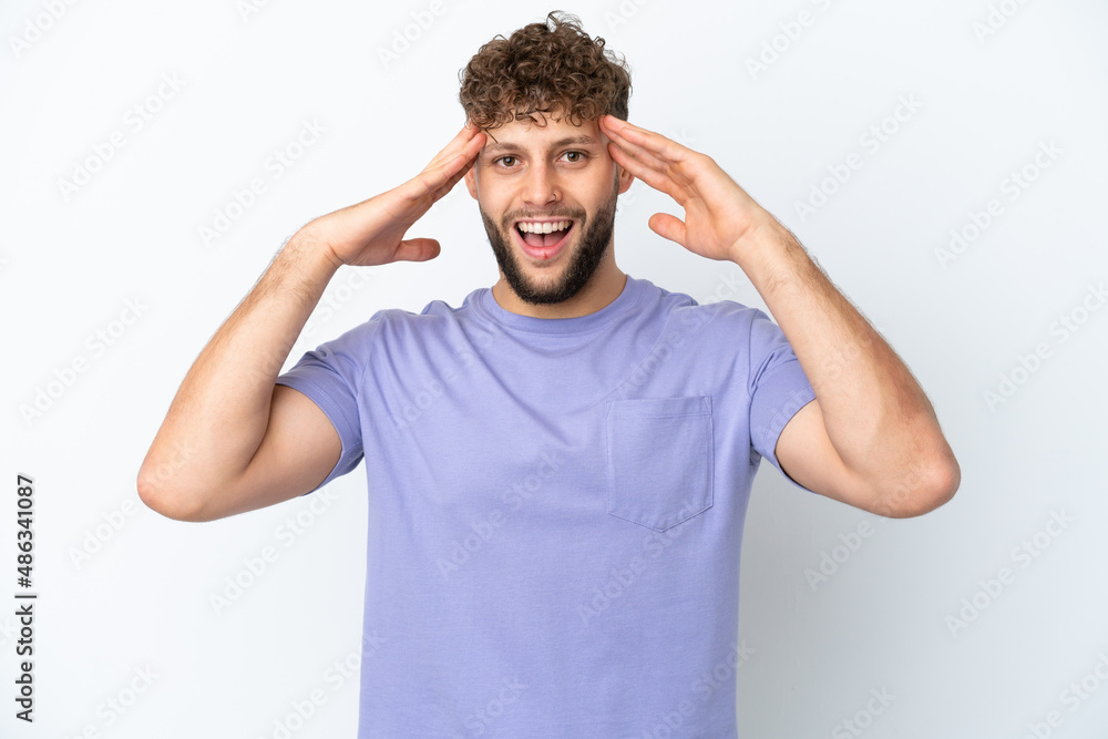 Young handsome caucasian man isolated on white background with surprise expression Young handsome caucasian man isolated on white background with surprise expression