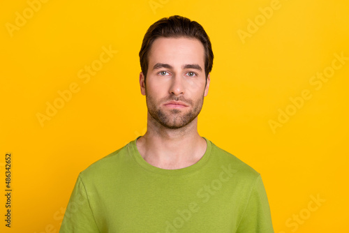 Photo of young man calm peaceful smart wear casual clothes stubble isolated over yellow color background © deagreez