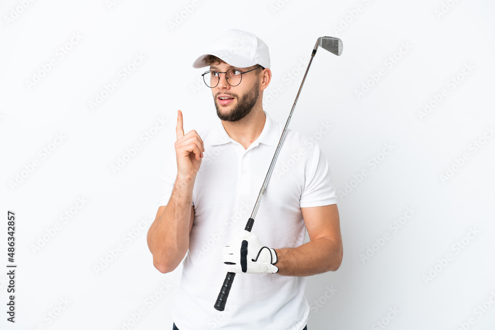 Handsome young man playing golf isolated on white background thinking an idea pointing the finger up Handsome young man playing golf isolated on white background thinking an idea pointing the finger up
