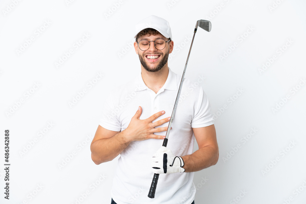 Handsome young man playing golf isolated on white background smiling a lot Handsome young man playing golf isolated on white background smiling a lot
