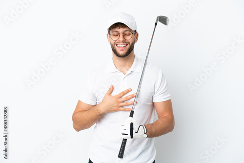 Handsome young man playing golf isolated on white background smiling a lot