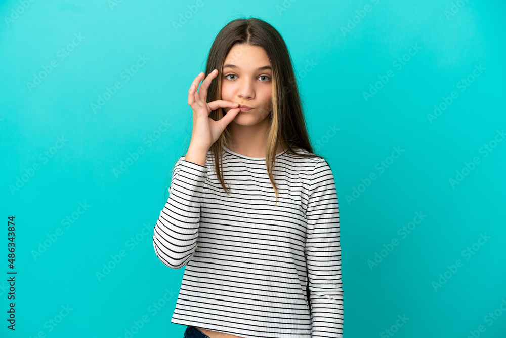 Little girl over isolated blue background showing a sign of silence gesture Little girl over isolated blue background showing a sign of silence gesture